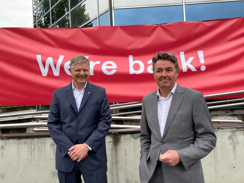 Norwegian Air CEO Jacob Schram and CFO Geir Karlsen pose for a photo in Oslo