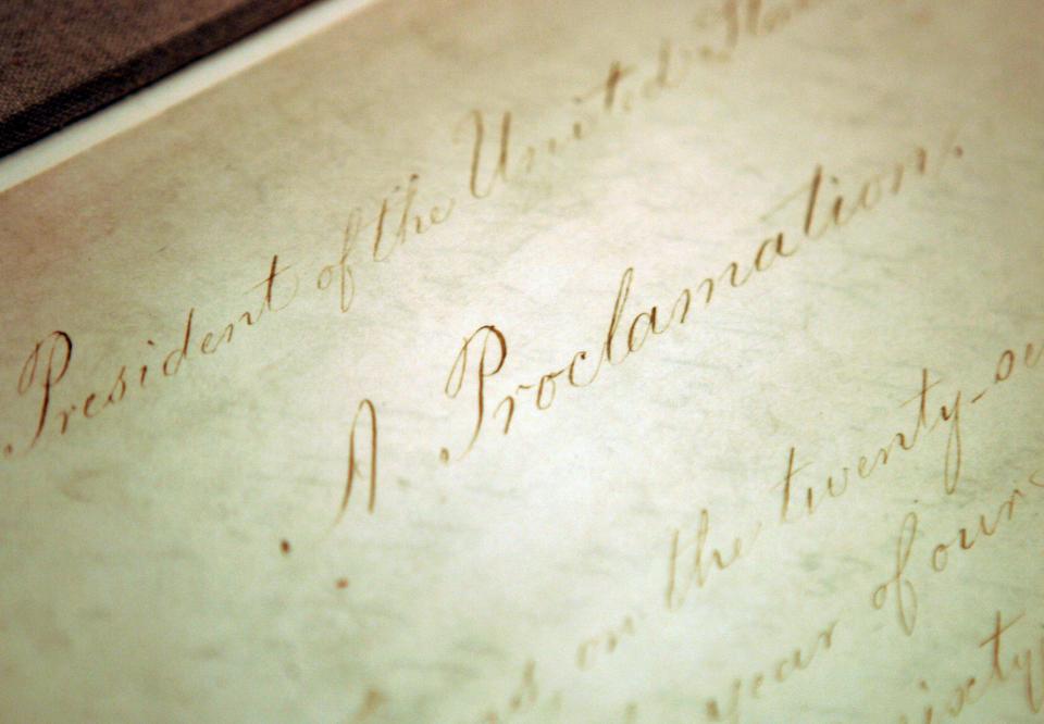 This file photo shows the original Emancipation Proclamation on display in the Rotunda of the National Archives in Washington. President Abraham Lincoln issued the Emancipation Proclamation declaring all slaves free in Confederate territory.