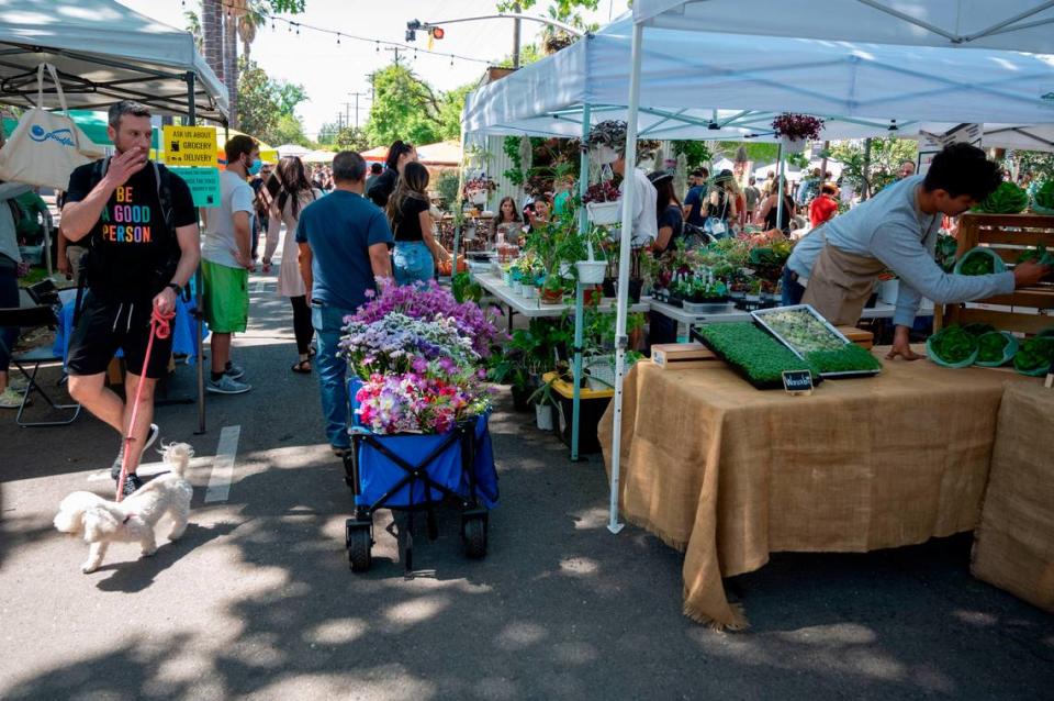 People shop at the Midtown Farmer’s Market on Saturday, April 30, 2022. It’s ​is a free and ​family-friendly year-round market that offers locally-grown fresh produce, prepared foods, artisian crafters and more. It’s open 8 a.m. to 1 p.m. on Saturdays on 20th Street between J and L streets and K Street between 19th and 21st streets.