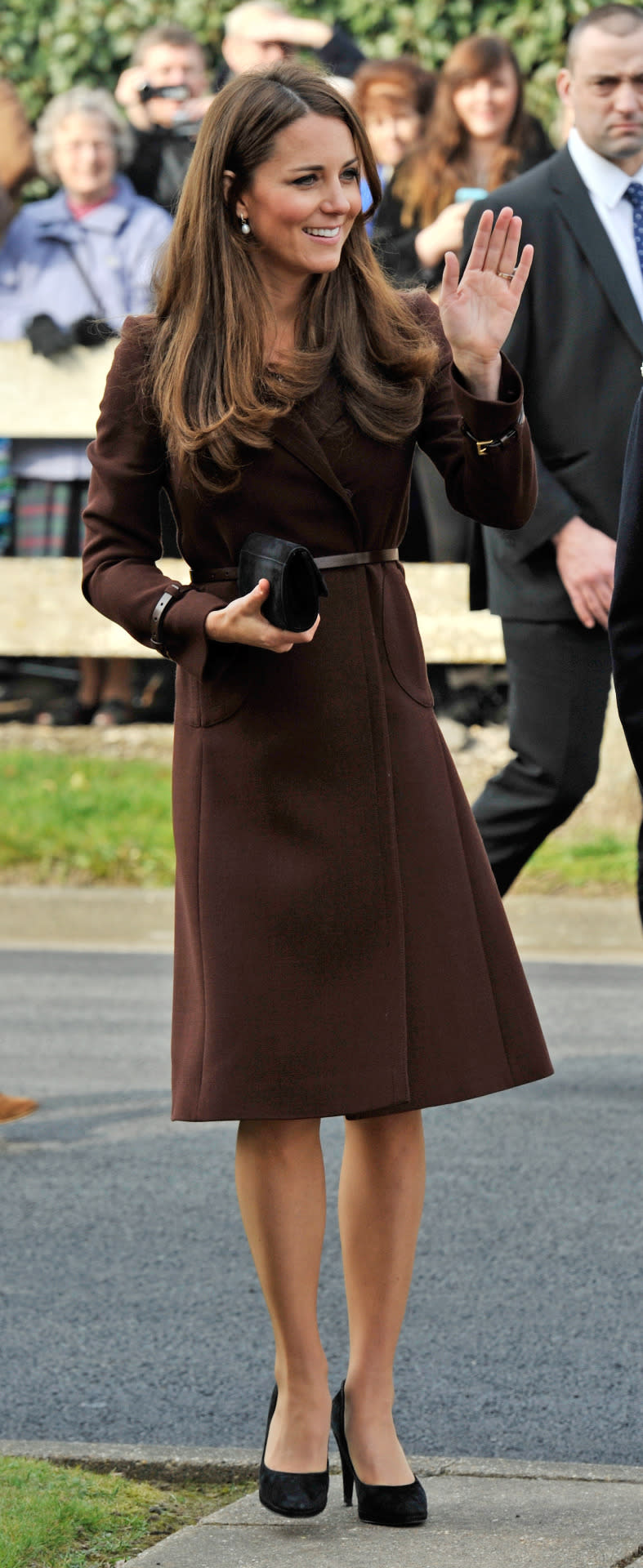 <p>Kate visited Grimsby in a chic brown Hobbs coat teamed with a black suede clutch and matching heels.</p><p><i>[Photo: PA]</i></p>