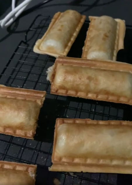 Sausage rolls on a cooling rack