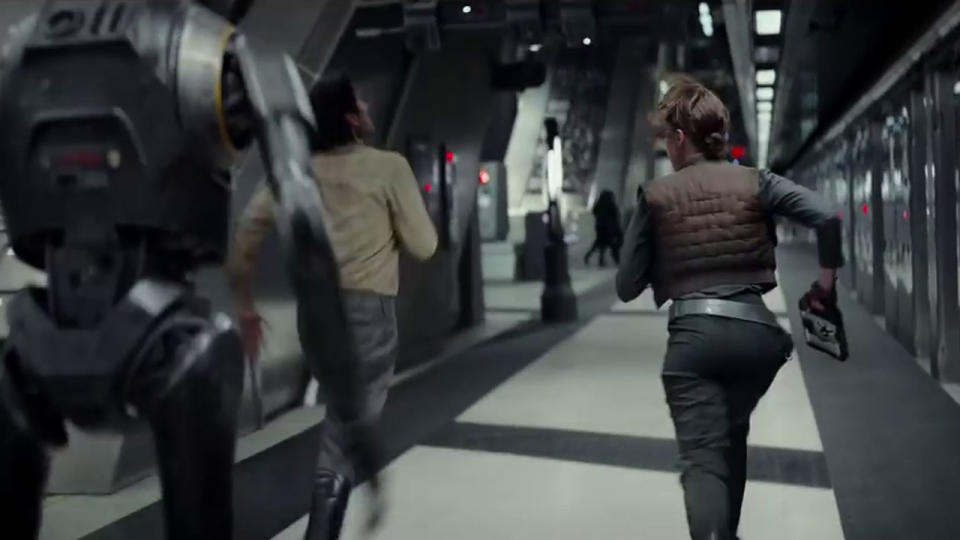 <p>This scene was shot in Canary Wharf Tube station, and seems to be part of the same sequence with Jyn, Cassian, and K2SO escaping with plans – you can see them in her hand here. Credit: Lucasfilm/Disney </p>