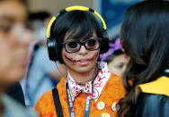 Lauren Lim chats with her friend as she attends Comic-Con. REUTERS/Mike Blake