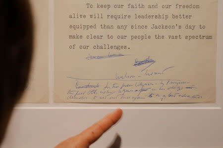 Curator Stacey Bredhoff points to a handwritten note by John F. Kennedy on his 1959 campaign speech in Yakima, Washington, part of the exhibit "JFK 100," marking the 100th anniversary of Kennedy's birth May 29, at the John F. Kennedy Presidential Library in Boston, Massachusetts, U.S., May 19, 2017. REUTERS/Brian Snyder