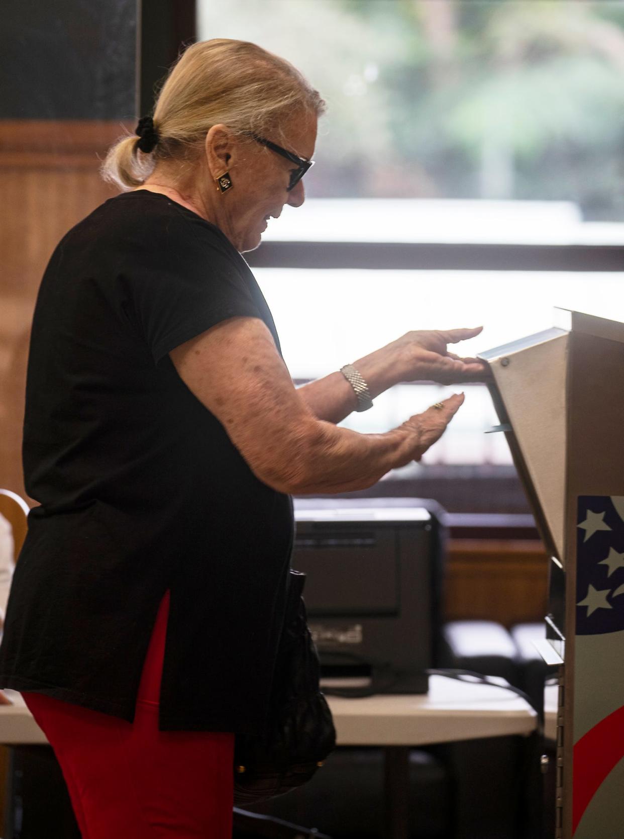 Local resident Cindy Thompson casts her ballot Wednesday, January 26, 2022 at Norris Community Center in downtown Naples. Early voting for the city began at 10 am, as residents voted for city council candidates. 