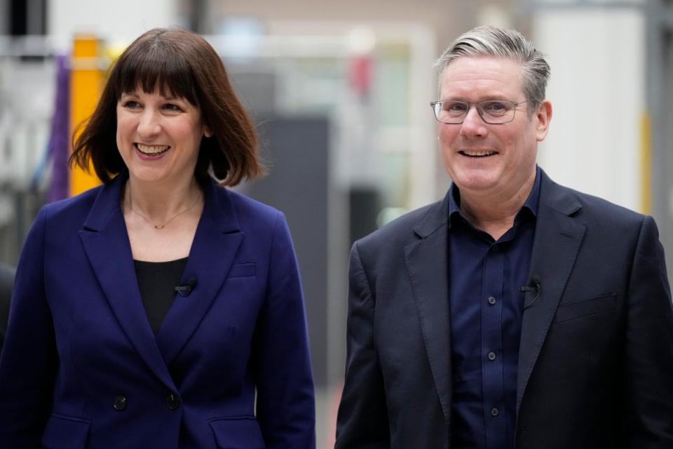 Rachel Reeves and Keir Starmer told reporters in Westminster that the flagship green policy had been scaled back (Getty Images)