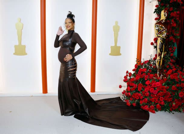 PHOTO: Rihanna poses on the champagne-colored red carpet during the Oscars arrivals at the 95th Academy Awards in Hollywood, March 12, 2023. (Eric Gaillard/Reuters)
