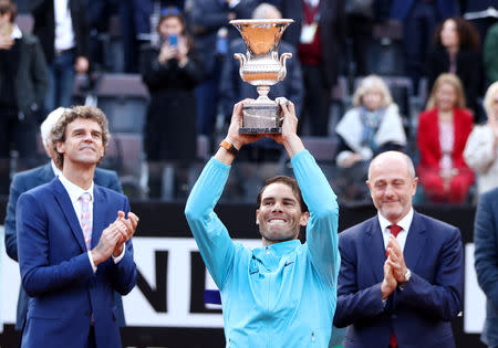 Tennis - ATP 1000 - Italian Open - Foro Italico, Rome, Italy - May 19, 2019 Spain's Rafael Nadal poses as he celebrates winning the final against Serbia's Novak Djokovic with the trophy REUTERS/Matteo Ciambelli