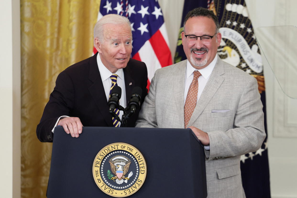 U.S. President Joe Biden and Secretary of Education Miguel Cardona deliver remarks during the Council of Chief State School Officers' 2022 National and State Teachers of the Year event, in the East Room at the White House, in Washington, U.S., April 27, 2022. REUTERS/Evelyn Hockstein