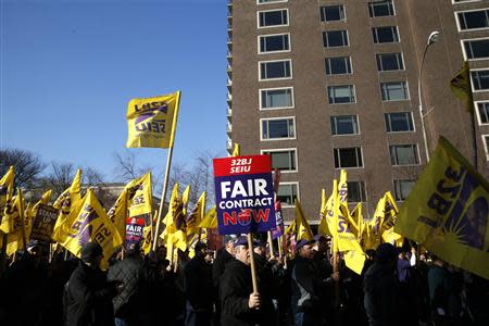 Members of the Service Employees International Union (SEIU) march during a protest in support of a new contract for apartment building workers in New York City, April 2, 2014. REUTERS/Mike Segar