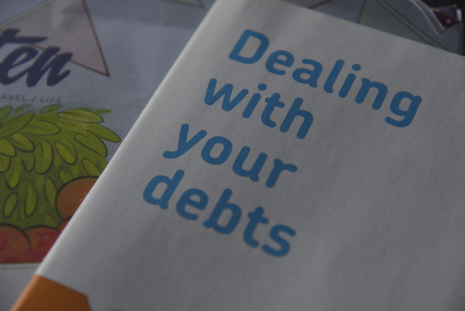 A paper booklet, provided by the Citizens Advice Bureau in the United Kingdom, advising a reader on how to tackle their personal debt. Photo: NurPhoto for Getty Images