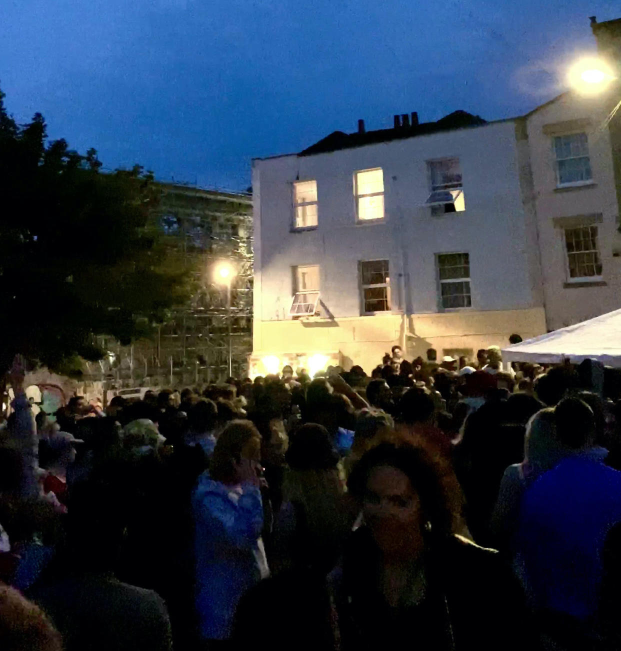 The huge crowd drank and danced the night away in front of a DJ playing dub music at the impromptu event in Stokes Croft, Bristol. (SWNS)