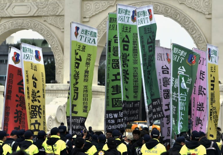 Pro-Taiwan indepedence activists hold banners on the 70th anniversary of the "228 Incident", a violent mainland crackdown