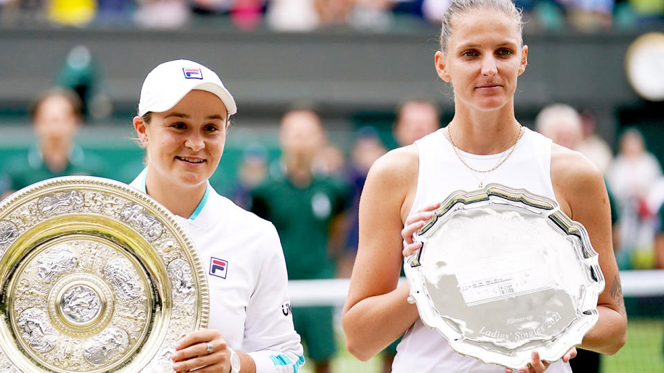 Ash Barty and Karolina Pliskova, pictured here with their trophies after the Wimbledon final.