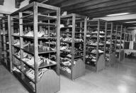 FILE - Shoes belonging to Philippine former first lady Imelda Marcos are seen lined up on shelves in the basement of the Malacanang Palace in Manila in this March 11, 1986 file photo. Termites, storms and neglect have damaged part of former Philippine first lady Imelda Marcos' legendary stash of shoes and other vanity possessions, left after she and her dictator husband were driven to U.S. exile by a 1986 popular revolt. (AP Photo/FILE)