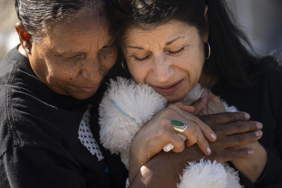 Jeanne LeGall and Claudia Carballada embrace