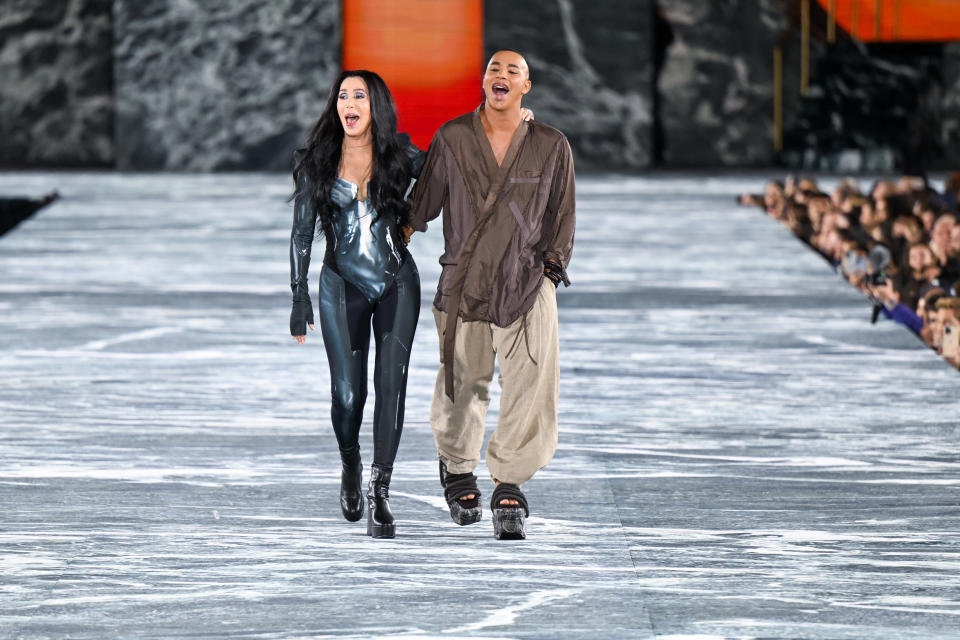 Singer Cher and Olivier Rousteing walk the runway during the Balmain Womenswear Spring/Summer 2023 show as part of the Balmain Festival V03 during the Paris Fashion Week on September 28, 2022 in Paris, France. (Photo by Stephane Cardinale - Corbis/Corbis via Getty Images)