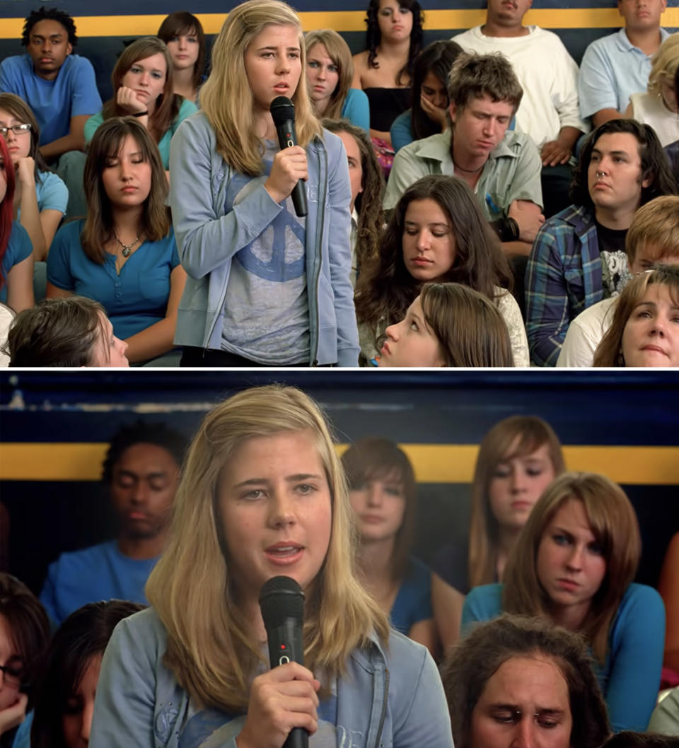 closeup of her speaking into a mic in a school gym