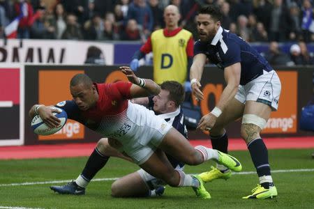 Rugby Union - Six Nations Championship - France v Scotland - Stade de France, Saint-Denis near Paris, France - 12/2/2017. France's Gael Fickou scores a try as Scotland Stuart Hogg tries to stop him. REUTERS/Pascal Rossignol