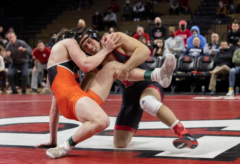 Rutgers' 184-pounder John Poznanski takes Princeton's Michael Squires down to the mat during his 15-6 major decision in the Scarlet Knights' 24-13 win Friday night.