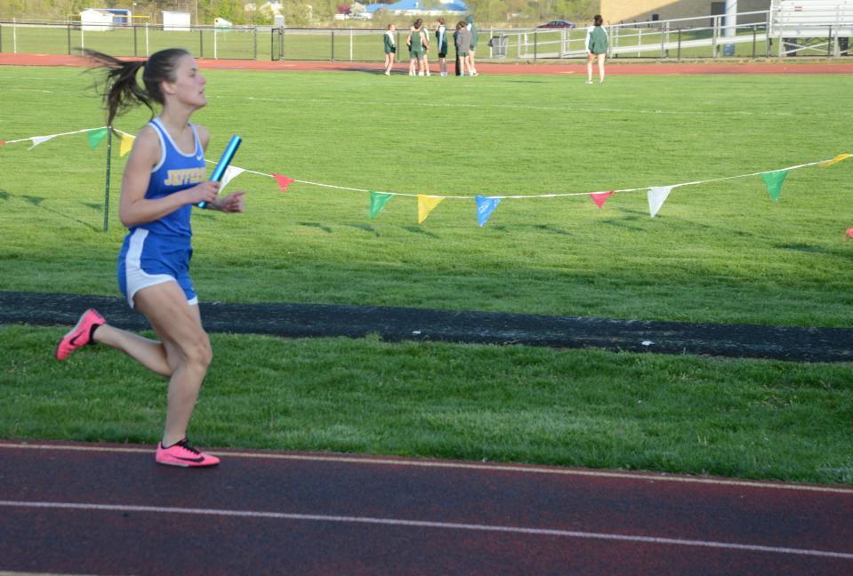 Ellie Hintz runs the final leg of the 1,600 relay for Jefferson Tuesday.