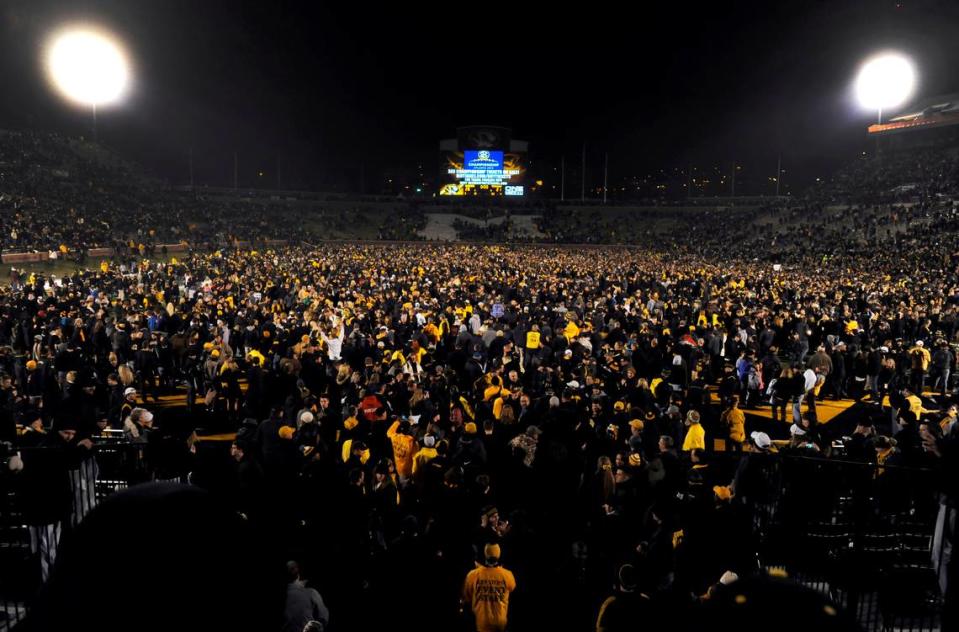 Fans celebrate on the field following Missouri’s 28-21 victory over Texas A&M in an NCAA college football game on Saturday, Nov. 30, 2013, in Columbia, Mo. (AP Photo/L.G. Patterson)