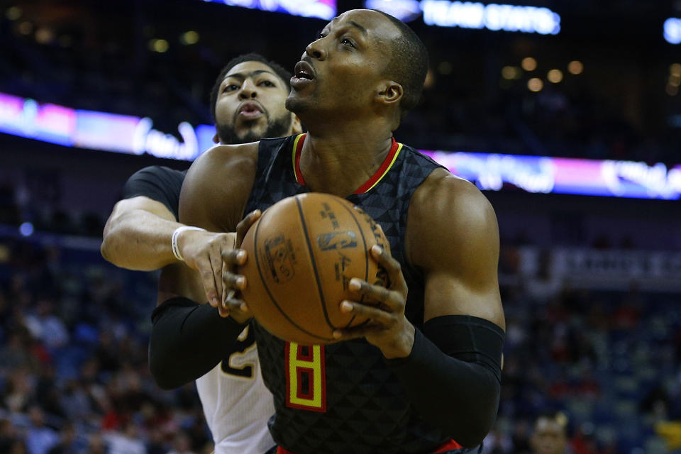 Anthony Davis would reportedly prefer Dwight Howard bear the brunt of banging with Western Conference centers. (Getty)