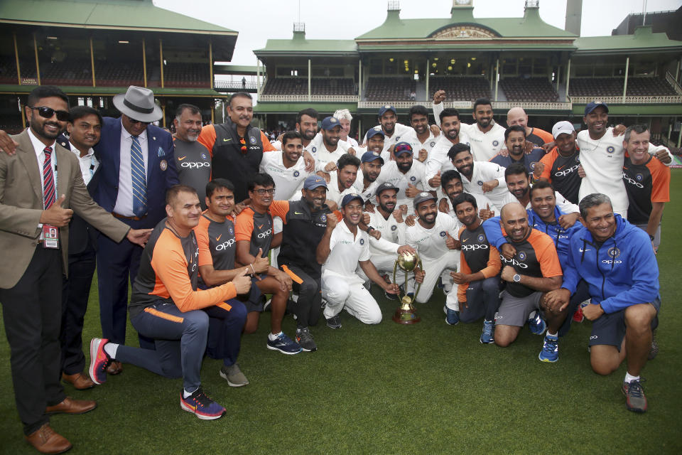 The Indian cricket team and support staff celebrate their series win over Australia after play was called off on day 5 of their cricket test match in Sydney, Monday, Jan. 7, 2019. The match is a draw and India wins the series 2-1. (AP Photo/Rick Rycroft)