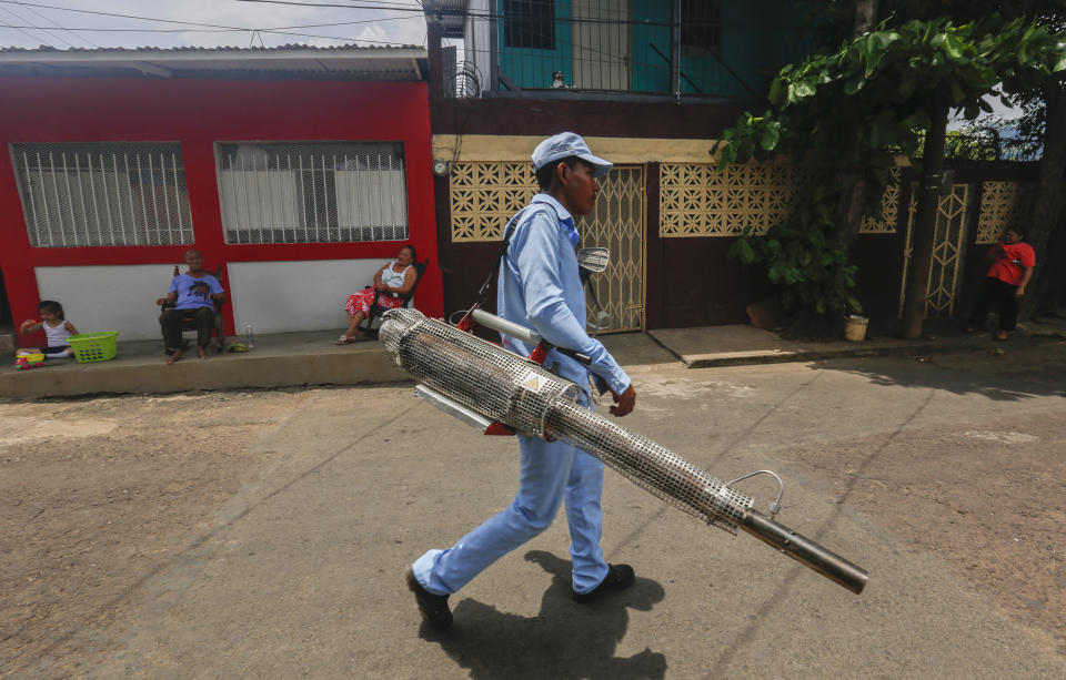 In this photo taken on Sept. 4, 2019, a worker walks the streets during a day of fumigation in Managua, Nicaragua. As a region, Central America and Mexico have already recorded nearly double the number of dengue cases as in all the previous year. (AP Photo/Alfredo Zuniga)