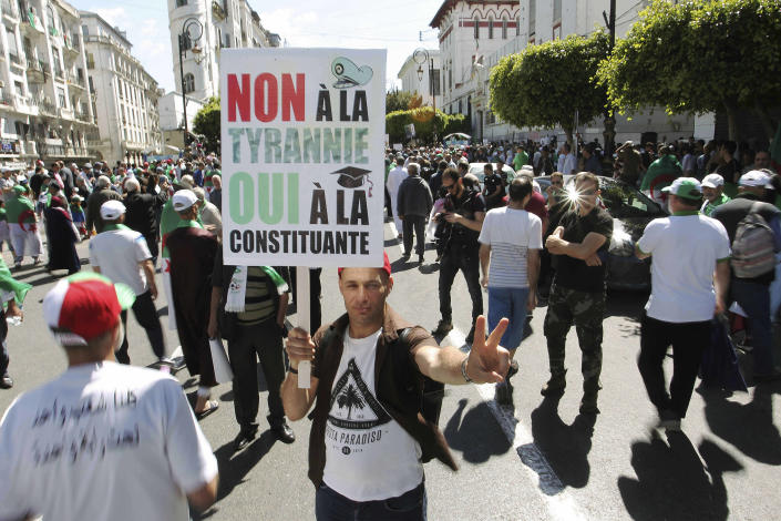 Algerian protesters gather during an anti-government demonstration in the centre of the capital Algiers, Algeria, Friday, May 31, 2019. Banner in French reads "No to tyranny, yes to constitution." (AP Photo/Fateh Guidoum)