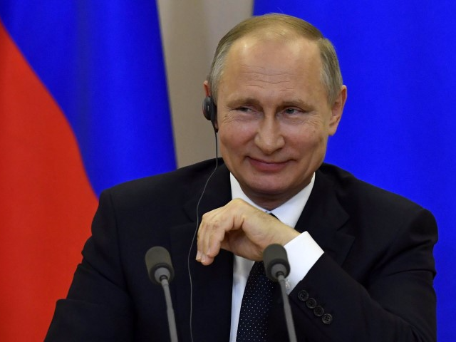 Russian President Vladimir Putin smiles during a joint press conference with Italian Prime Minister Paolo Gentiloni following their meeting at the Bocharov Ruchei state residence in Sochi, Russia, May 17, 2017. REUTERS/Yuri Kadobnov/Pool    