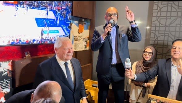 Premier Doug Ford (left) and PC MPP-elect Zee Hamid seen at the PC victory party in Milton. Hamid won the Milton byelection with about 47 per cent of the vote. 