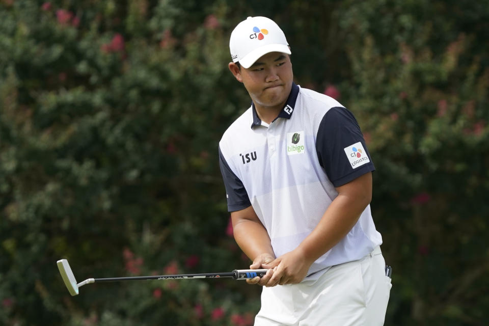 Joohyung Kim, of South Korea, reacts to missing a putt on the ninth hole during the third round of the Wyndham Championship golf tournament in Greensboro, N.C., Saturday, Aug. 6, 2022. (AP Photo/Chuck Burton)