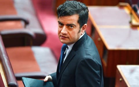 Australian opposition Senator Sam Dastyari leaves the Senate chamber at Parliament House in Canberra, Australia