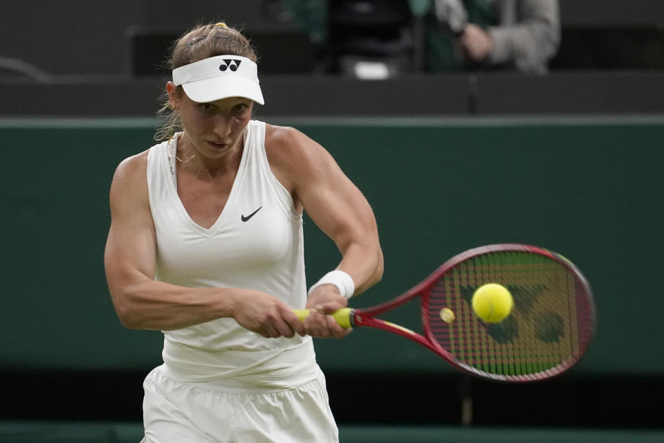 Germany's Tamara Korpatsch returns the ball to Britain's Heather Watson during their women's singles tennis match on day one of the Wimbledon tennis championships in London, Monday, June 27, 2022. (AP Photo/Alberto Pezzali)