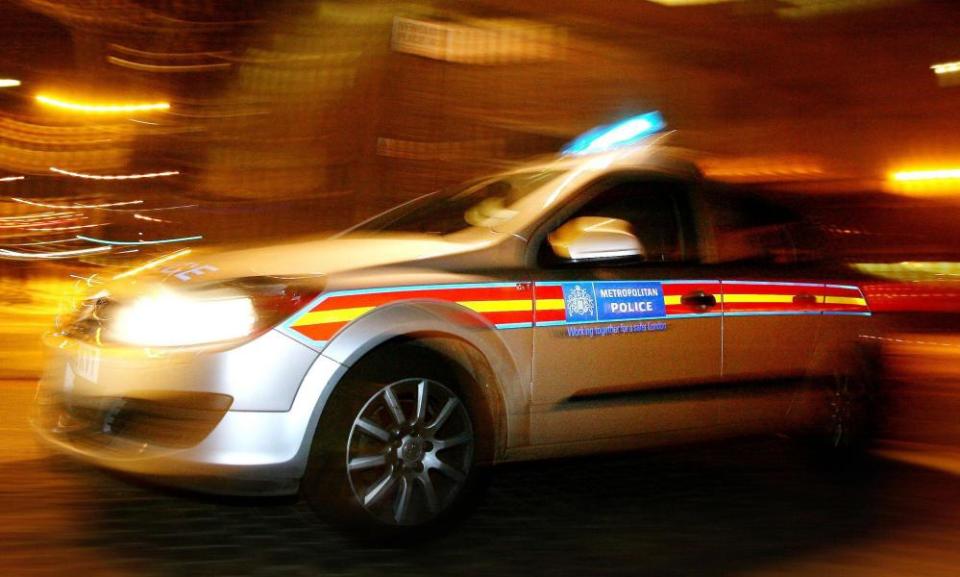 A police car driving through London at high speed