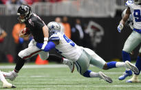 Dallas Cowboys defensive end Randy Gregory (94) tackles Atlanta Falcons quarterback Matt Ryan (2) during the first half of an NFL football game, Sunday, Nov. 18, 2018, in Atlanta. (AP Photo/John Amis)