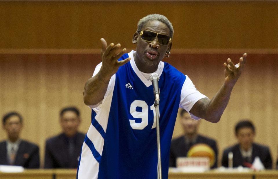 FILE - In this Jan. 8, 2014 file photo, former NBA star Dennis Rodman sings "Happy Birthday" to North Korean leader Kim Jong Un, seated above in the stands, before an exhibition basketball game at an indoor stadium in Pyongyang, North Korea. North Korea marked Kim Jong Un's birthday on Sunday, Jan. 8, 2017, in a decidedly low-key manner. Kim, who is believed to be 33 or 34 and the world's youngest head of state, assumed power after the death of his father, Kim Jong Il, in late 2011. (AP Photo/Kim Kwang Hyon, File)