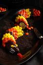 <p>Peanut butter, chocolate, and bananas — what could be better? Rolling all those flavors together into a slithery sweet snake for Halloween, that's what.</p><p>Get the <strong><a href="https://www.womansday.com/food-recipes/food-drinks/recipes/a11984/peanut-chocolate-banana-snakes-recipe-123645/" rel="nofollow noopener" target="_blank" data-ylk="slk:Peanut and Chocolate Banana Snakes recipe;elm:context_link;itc:0;sec:content-canvas" class="link ">Peanut and Chocolate Banana Snakes recipe</a></strong>.</p>