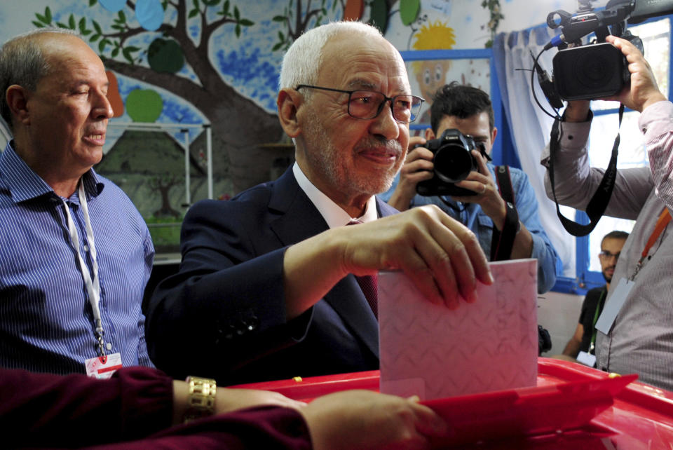 FILE - President of the Islamist party Ennahda and candidate for the Parliamentary election Rached Ghannouchi votes in a polling station south of Tunis, Tunisia, Sunday, Oct. 6, 2019. Tunisia presidency says the North African country will hold its next presidential elections on Oct. 6, 2024. The main opposition coalition that includes the once-powerful Ennahdha Islamic party, said it won’t take part in the vote unless Saied’s political opponents are freed and judicial independence is restored.(AP Photo/Hassene Dridi, File)