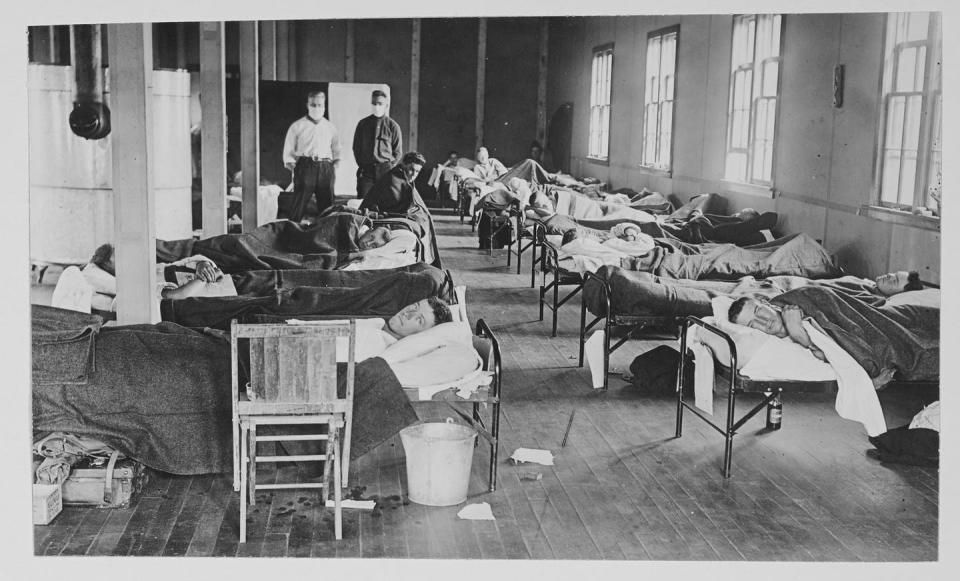 <span class="caption">Patients with the Spanish flu at a barracks hospital in Fort Collins, Colorado, 1918.</span> <span class="attribution"><a class="link " href="https://www.gettyimages.com/detail/news-photo/view-of-victims-of-the-spanish-flu-cases-as-they-lie-in-news-photo/906330984?adppopup=true" rel="nofollow noopener" target="_blank" data-ylk="slk:Getty Images / Photo Quest;elm:context_link;itc:0;sec:content-canvas">Getty Images / Photo Quest</a></span>