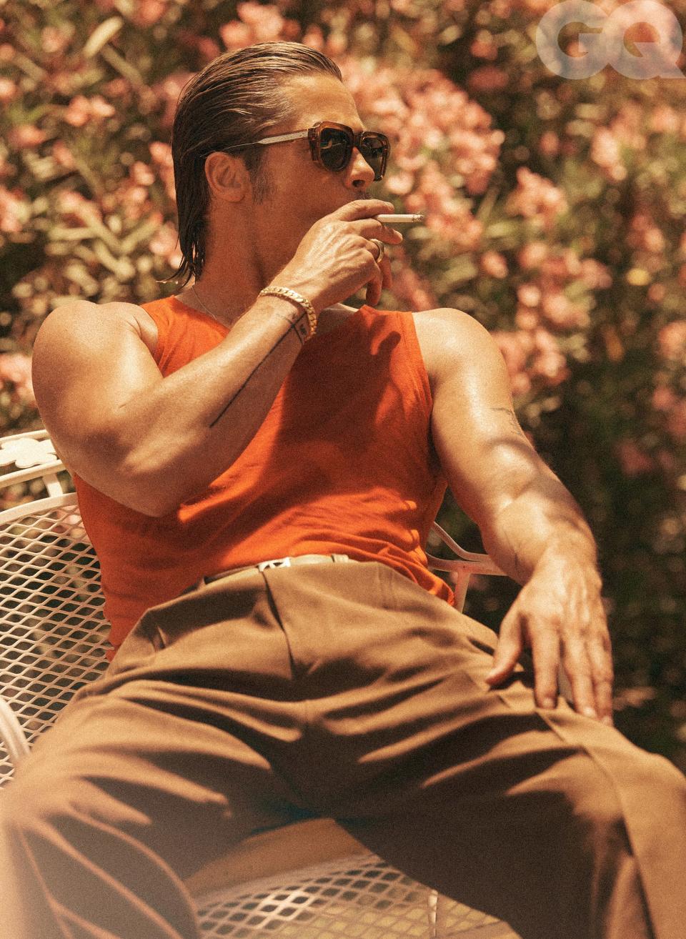 <cite class="credit">Tank top, $125, by Stock Vintage / Pants, $1,150, by Gucci / Belt, $495, by Artemas Quibble / Sunglasses, $595, by Jacques Marie Mage</cite>