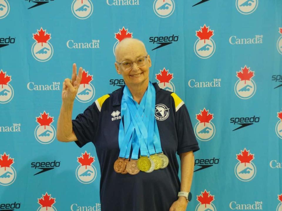 Not letting cancer stop her, Lina Courtois competed at the Canadian Masters Swimming Championships and Canadian Artistic Swimming Championships in Calgary. She took home three gold medals. (Submitted by Lina Courtois. - image credit)