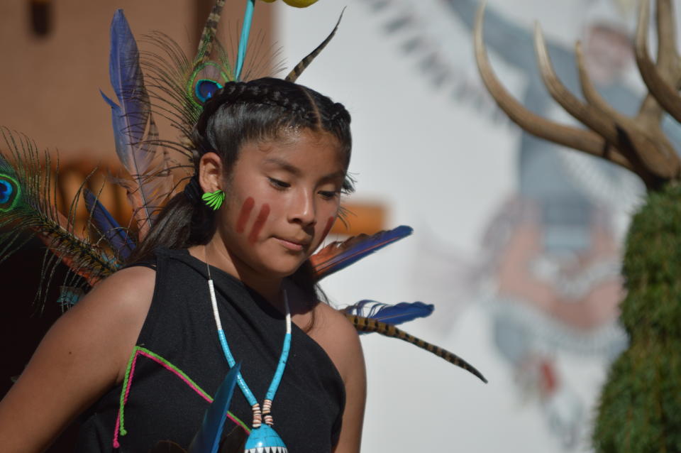 A dancer with the Acoma Sky City Ram Dancers from Acoma Pueblo, N.M. performs on Monday, Oct. 14, 2019, at the Indian Pueblo Cultural Center in Albuquerque, N.M. as part of New Mexico's first Indigenous Peoples Day. A handful of states celebrated Monday their first Indigenous Peoples Day on Monday as part of a trend to move away from a day honoring Christopher Columbus. (AP Photo/Russell Contreras)