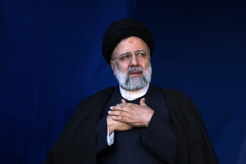 Iranian President Ebrahim Raisi places his hands on his heart as a gesture of respect to the crowd during the funeral ceremony of the victims of Wednesday’s bomb explosion in the city of Kerman about 510 miles (820 kms) southeast of the capital Tehran, Iran, Jan. 5, 2024. (AP Photo/Vahid Salemi, File)