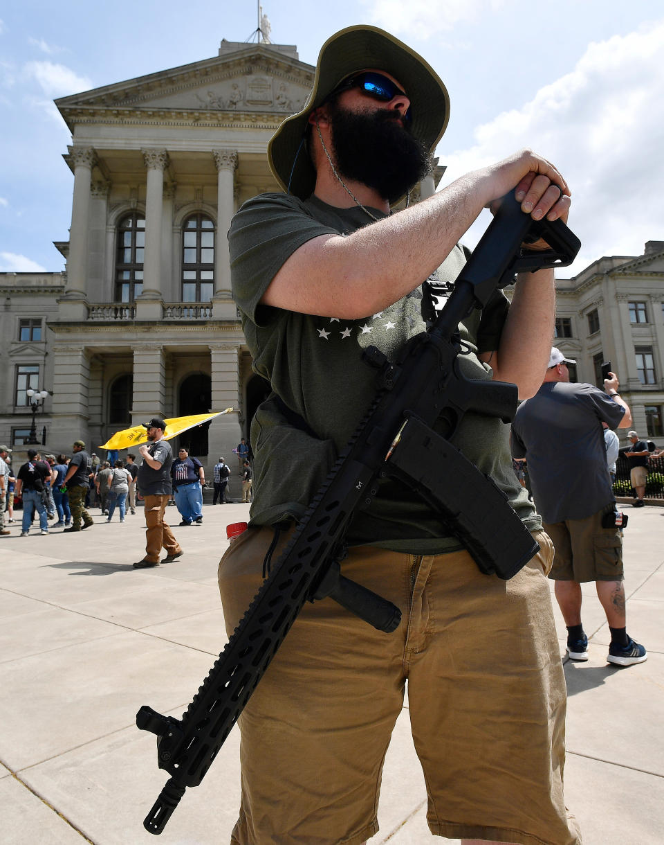 <p>Andrew Norris, of Monroe, Ga., participates in a gun-rights rally at the state capitol, Saturday, April 14, 2018, in Atlanta, Ga. About 40 gun rights supporters have gathered for one of dozens of rallies planned at statehouses across the U.S. (Photo: Mike Stewart/AP) </p>