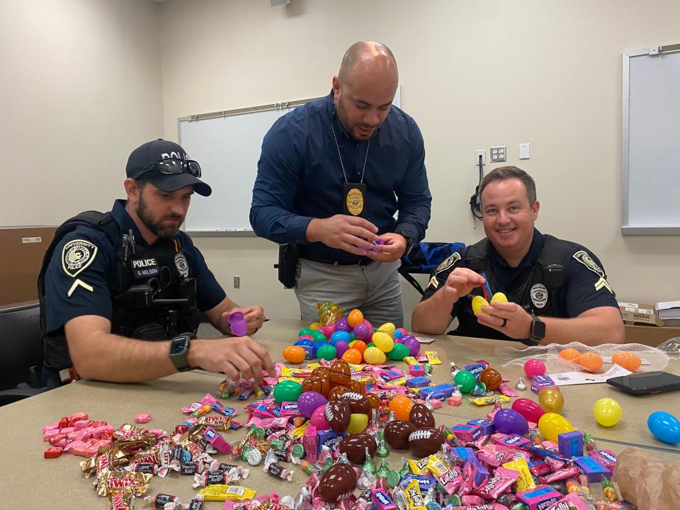 UCF police officers surprised children at the UCF Creative School with an egg hunt.