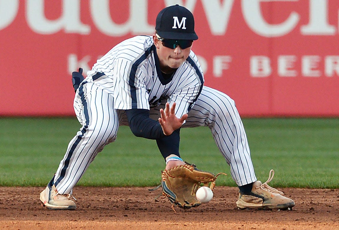 McDowell High School infielder Carter Swanson makes a play against Cathedral Prep at UPMC Park in Erie on April 20, 2023.