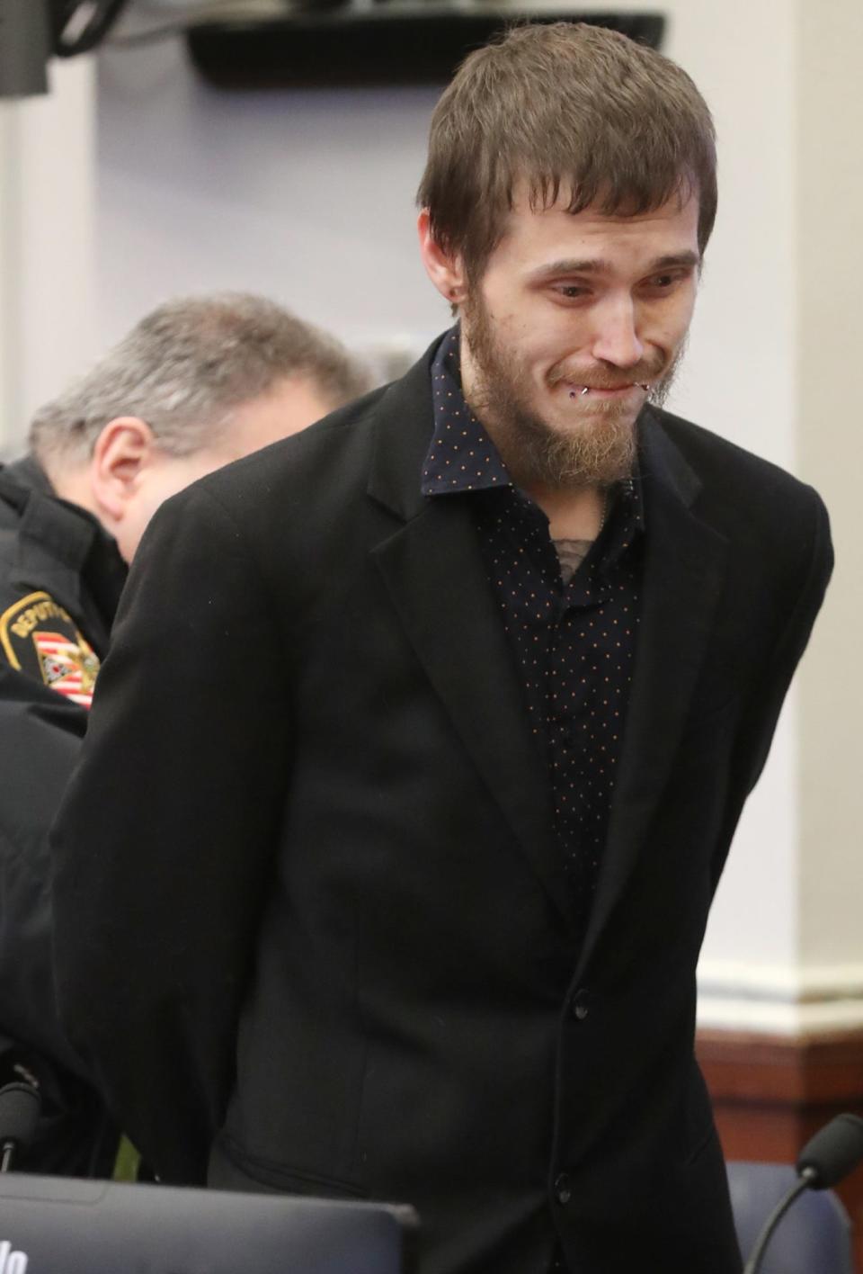 Brandon Mackey of Akron cries after being sentenced to prison in December in Summit County Common Pleas Court. Mackey pleaded guilty to strangulation and aggravated assault for an incident involving his former girlfriend.