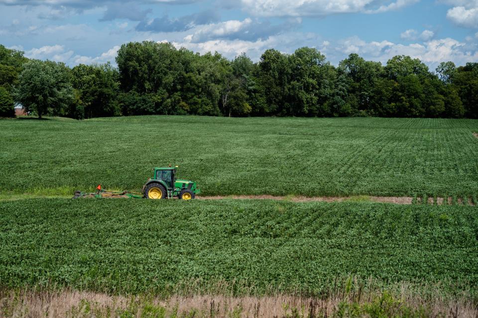 Nathan Videkovich, 15, mows a waterway in a soybean field on his family's farm in Ashville, Ohio in  2019.